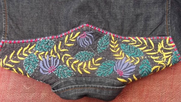 Hand embroidered denim shirt: detail of back yoke