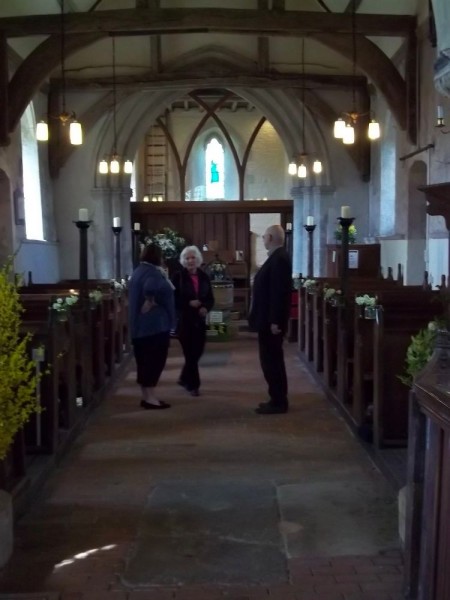 North Stoke Church: looking west, showing forsythia on the left and narcissi in jam jars at the ends of alternate pews. (Green and gorgeous, South Stoke, Oxon)