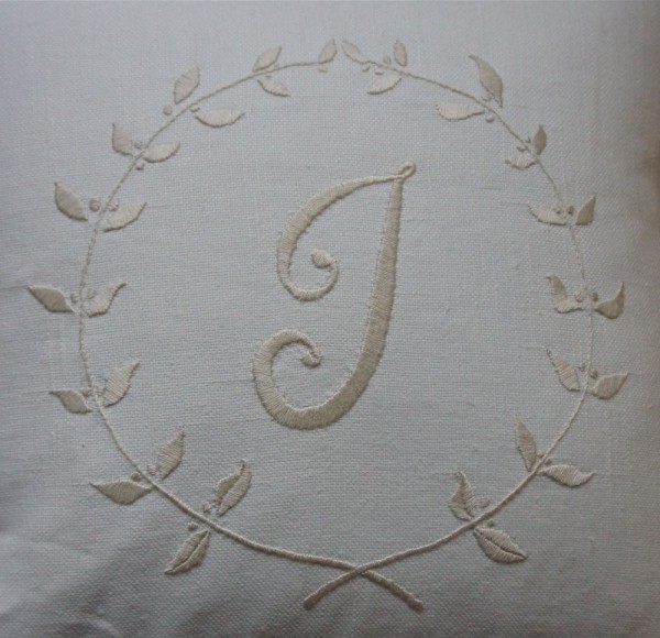 Linen union cushion: initial 'J' and leaves embroidered in ecru embroidery thread