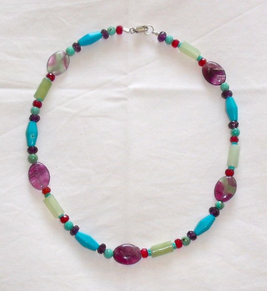 Necklace of semi-precious stones: garnet, amethyst, jade, fluorite and turquoise (or possibly howlite)