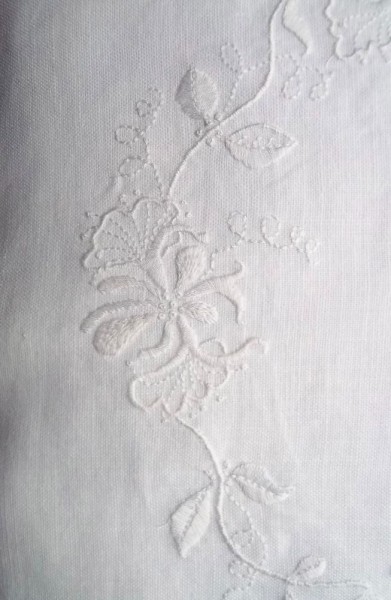 Whitework embroidered honeysuckle cushion: detail of hand embroidery