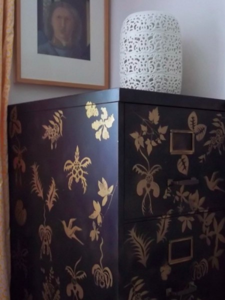 Metal filing cabinet stencilled with flowers foliage and birds in batik style