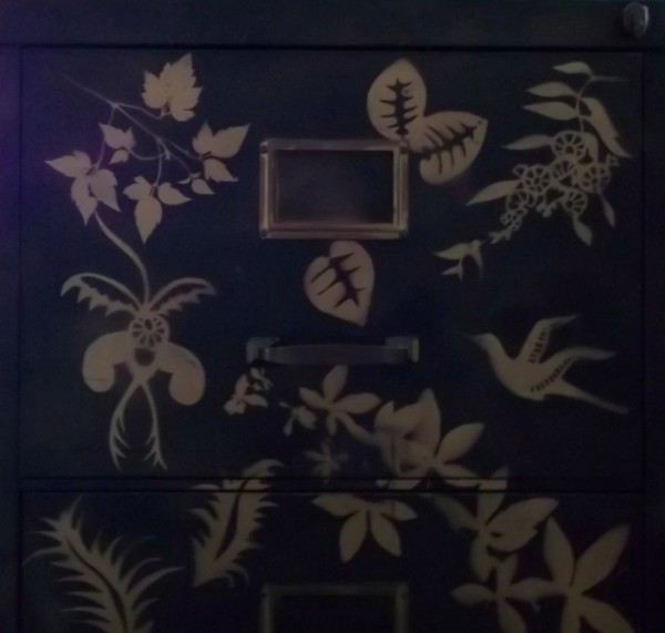 Stencilled flowers on metal filing cabinet