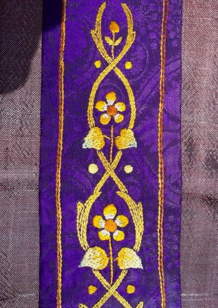 Purple stole: detail of hand embroidery