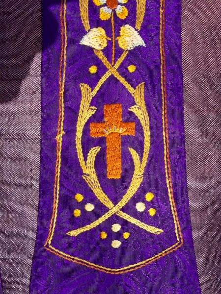Purple ecclesiastical stole: details of hand embroidery