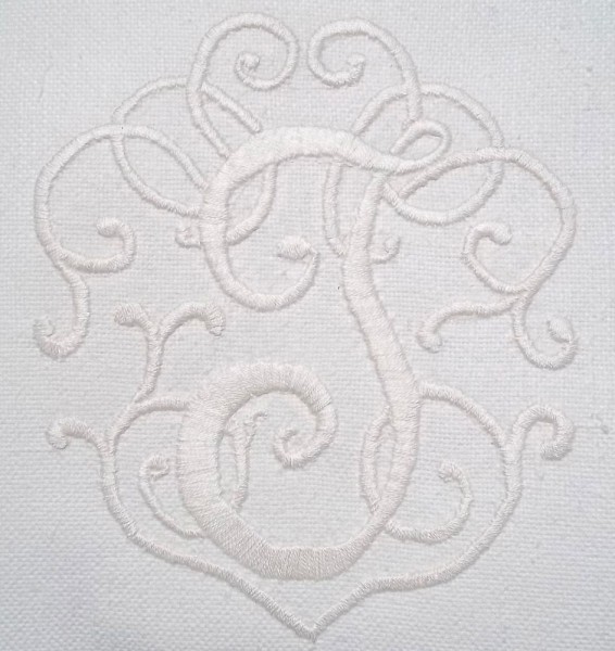 Whitework monogram 'J'  hand embroidered on a linen union cushion 