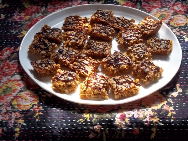 Flapjacks dribbled with dark chocolate