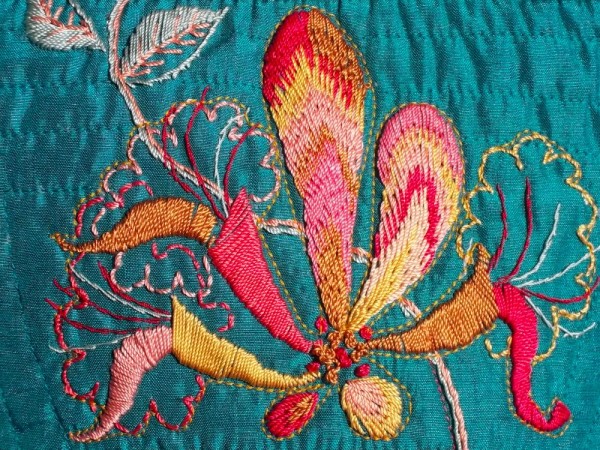 Detail of shoulder bag with embroidered honeysuckle
