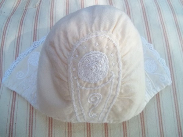 Baby christening bonnet with English smock embroidery: back view