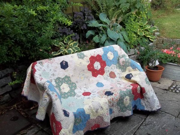 Grandmother's garden patchwork quilt (hand pieced and hand quilted)