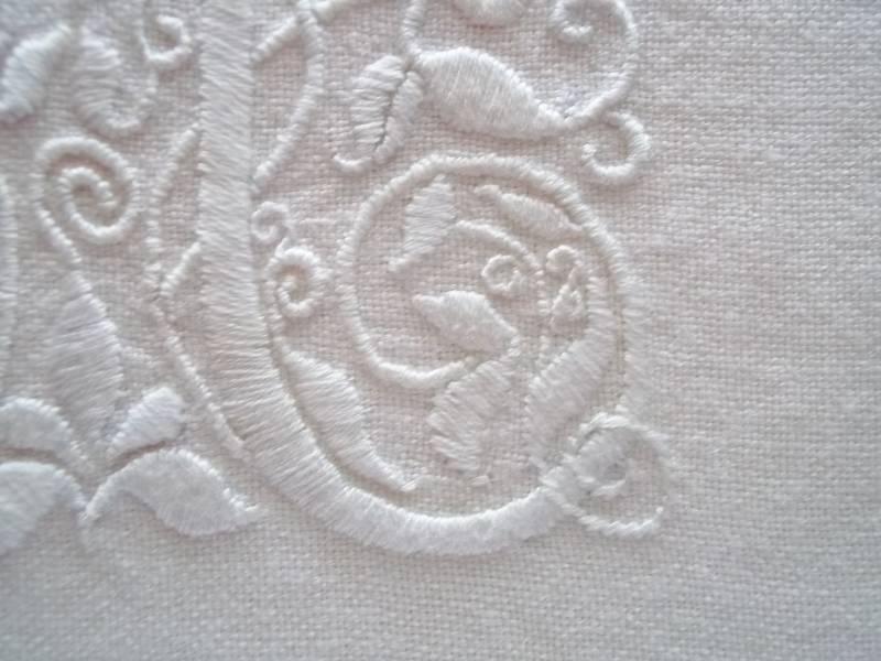 Whitework M: detail of hand embroidery in white embroidery cotton on white linen (Mary Addison)
