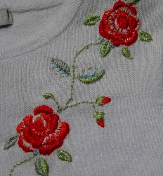 Rose embroidered cardigan: front detail (hand embroidered by Mary Addison)