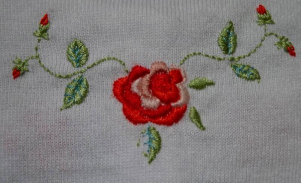 Rose hand-embroidered cardigan for a little girl (Mary Addison)