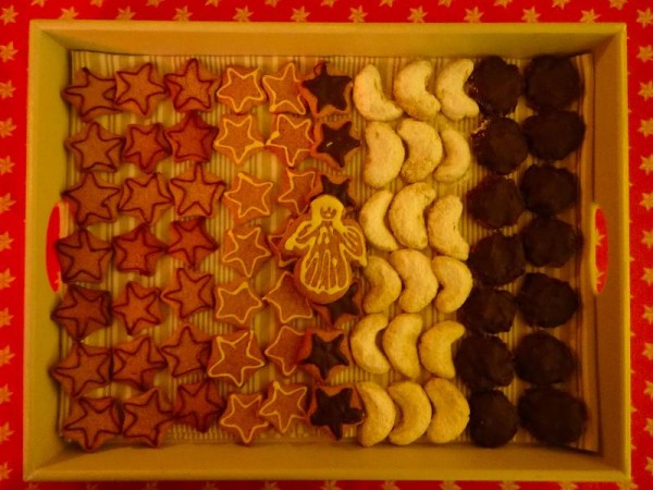 Tray of Christmas biscuits (gingerbread shapes, kipferl and lebkuchen) to have after Midnight Mass on Christmas Day