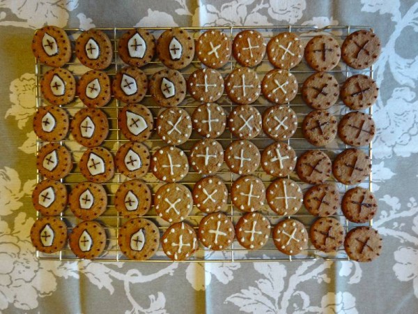Gingerbread biscuits with marzipan mitres and chocolate icing crosses