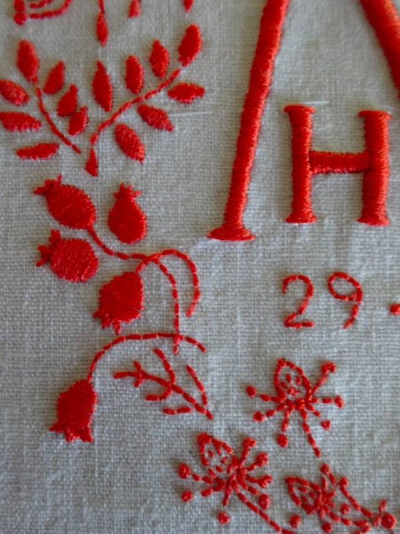 Embroidered seed heads and rose hips  