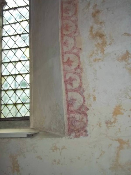 Ipsden Church, Oxon:detail of lace-like wall painting around window