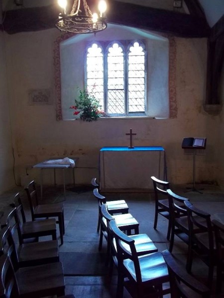 Ipsden church, Oxon: barn-like north aisle; chairs facing into the chancel.