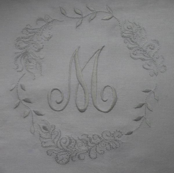 Cushion with monogram M, leaves and feathers (hand embroidered by Mary Addison)