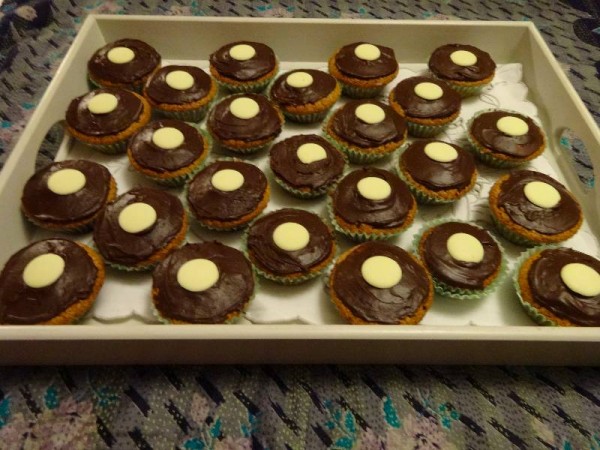 Milk chocolate cup cakes with chocolate fudge icing and white chocolate buttons 