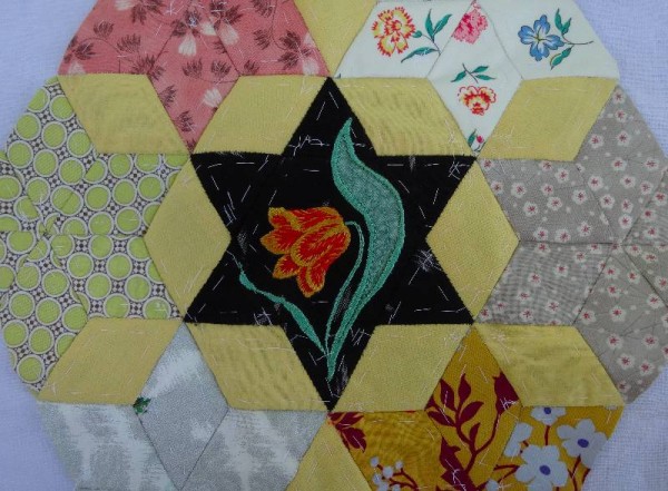 Ipsden Church, Oxon: patchwork altar frontal, detail of tulip (hand embroidered by Mary Addison)