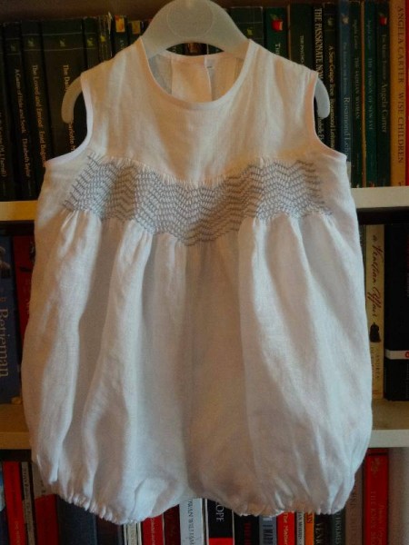 Smocked Christening romper suit in fine linen (smocked by Mary Addison) 