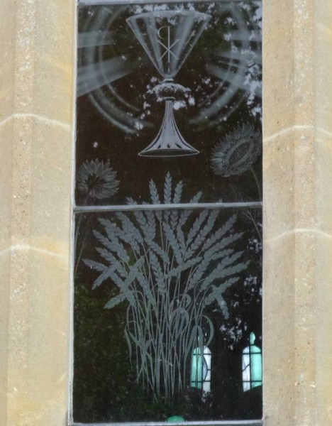 Checkendon church: Laurence Whistler engraved glass window commemorating Eric Kennington: detail showing wheatsheaf, sunflowers and  chalice