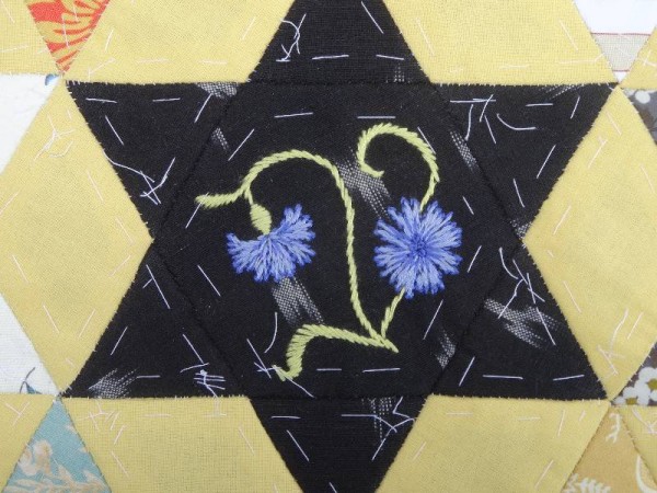 Ipsden Church, Oxon: patchwork altar frontal, detail of  cornflower (hand embroidered by Mary Addison) 