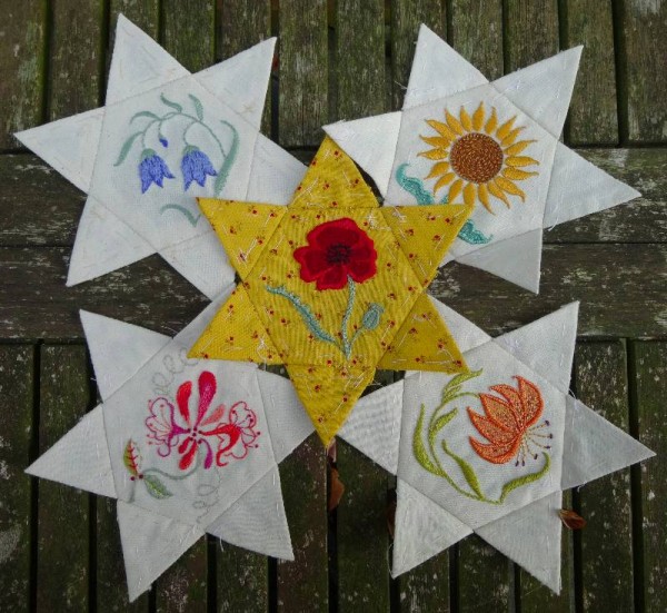 Rejected star patchwork pieces with hand embroidered flowers