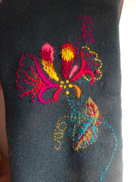 Honeysuckle embroidery on a darned sleeve of a much loved coat