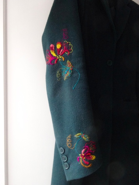 Wool coat with crewel embroidered honeysuckle and darned moth holes