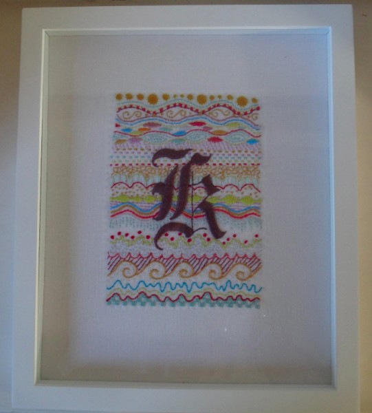 Framed Gothic k initial (hand embroidered by Mary Addison)