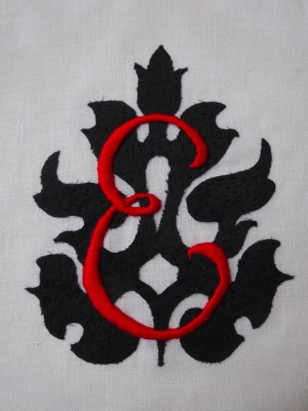 Scarlet and black monogrammed E (hand embroidered by Mary Addison)
