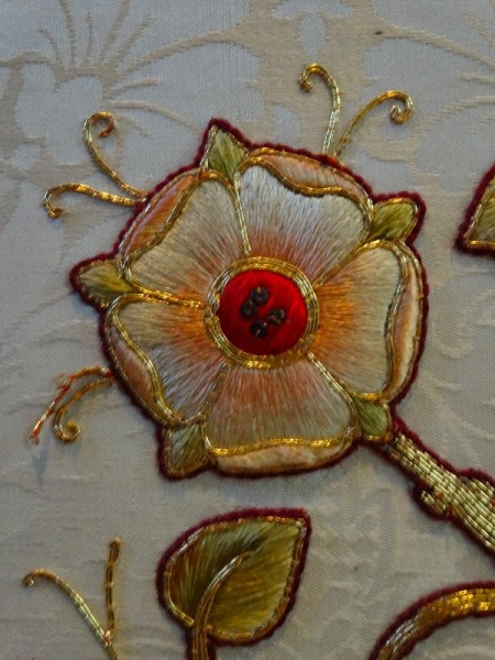 St MAry the Virgin, N.Stoke (Oxon): detail of rose from central panel of  white altar frontal