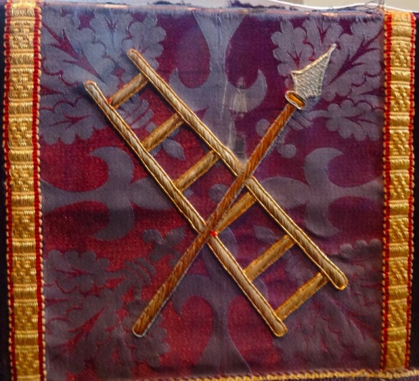 Purple altar frontal: symbols of the crucifixion, ladder & spear (North Stoke Church, Oxon.)