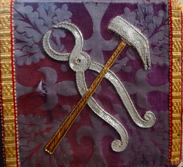 Purple altar frontal: symbols of the crucifixion, pillar and ropes (North Stoke Church, Oxon.)