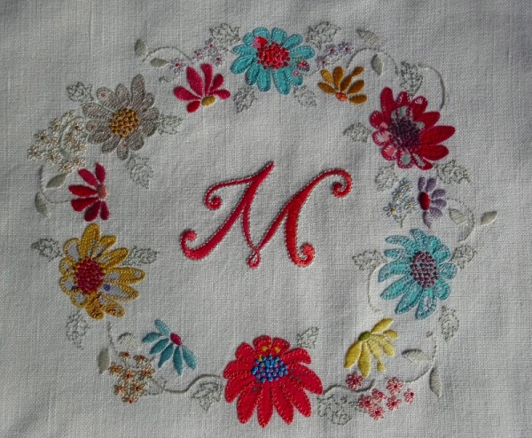 Monogram M with floral circlet (hand embroidered by Mary Addison)