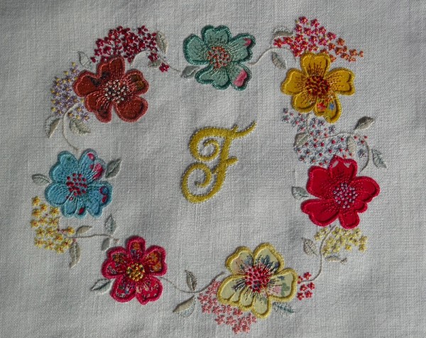 Monnogram F with floral circle (hand embroidered by Mary Addison)