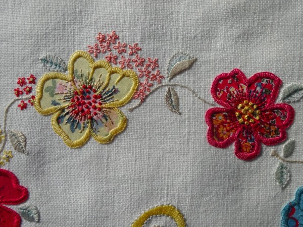 F monogram: detail of hand embroidered & appliquéd flowers 