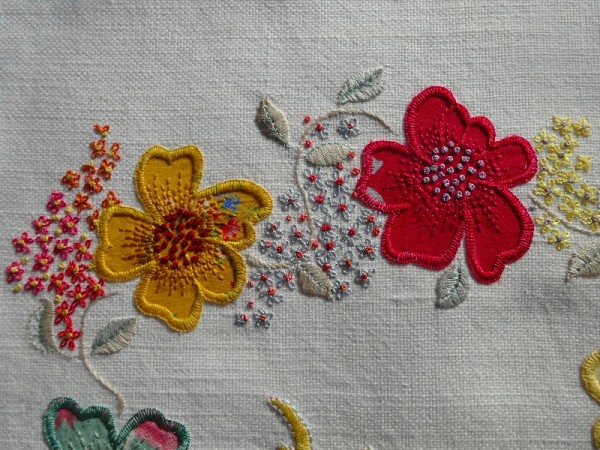 F monogram: detail of hand embroidered & appliquéd flowers 