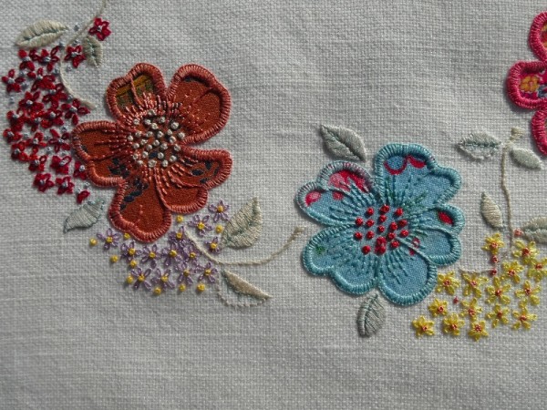 F monogram: detail of hand embroidered & appliquéd flowers 