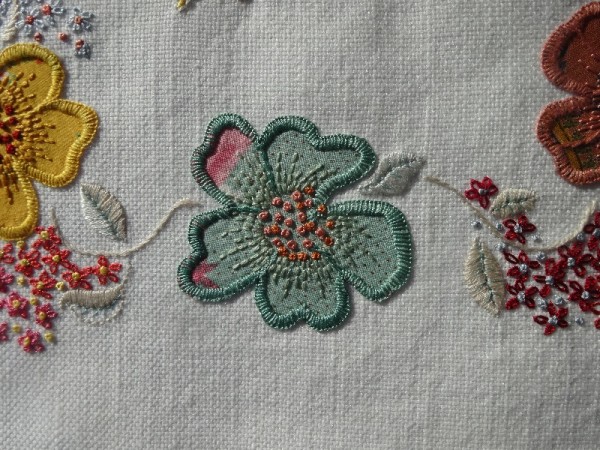 F monogram: detail of hand embroidered & appliquéd flowers 