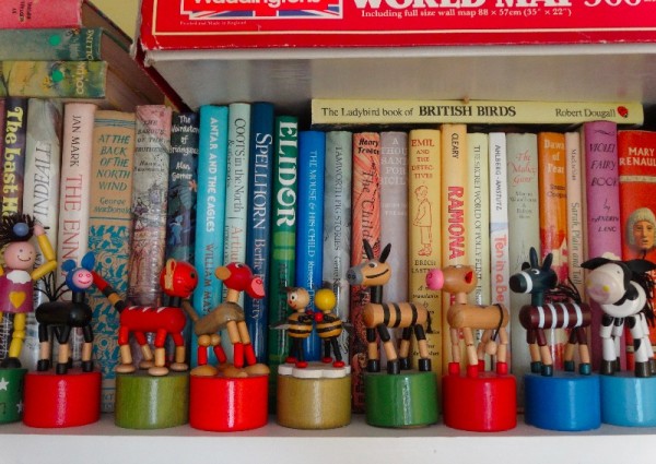 A row of wooden dancing toys