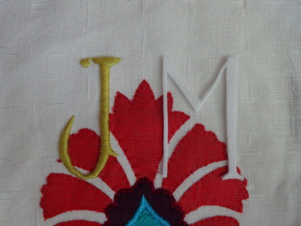 JM monogram in suzani style:  Stage 1 showing pure wool felt padding for letters