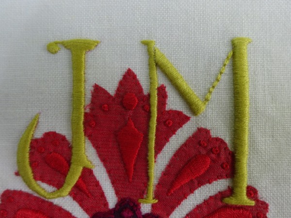 JM monogram in suzani style: Stage 4 showing embroidered letters
