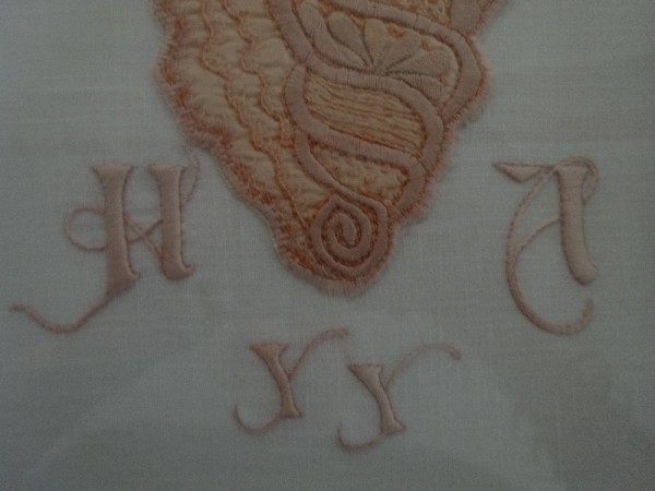 Shell embroidery with initial H,YY,A (hand embroidered by Mary Addison)