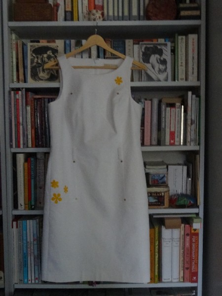 White Michael Kors dress  with lily stain covered by appliquéd silk daisies