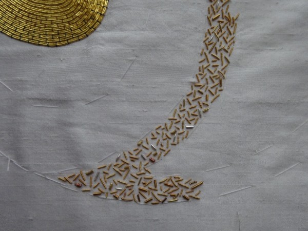 Goldwork sampler showing gold thread cut and used as beads