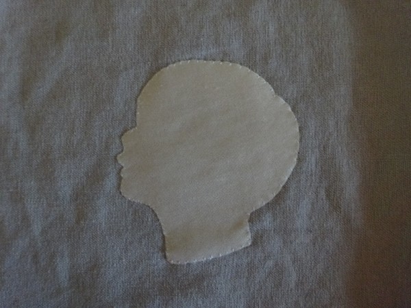 Silhouette head ( close up of the one framed in white above): silk on linen made by Mary Addison