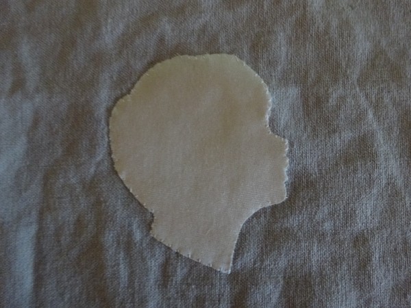 Silhouette head: silk on linen; rejected because of fraying around the mouth and nose. (Mary Addison)
